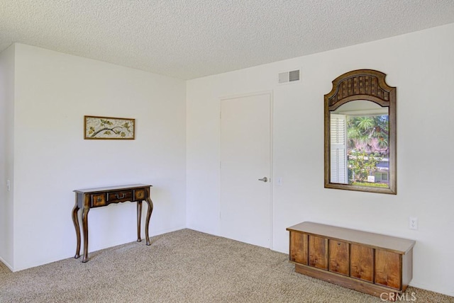 3424 Calle Azul Unit A, Laguna Woods, CA 92637 - empty room with light carpet and a textured ceiling