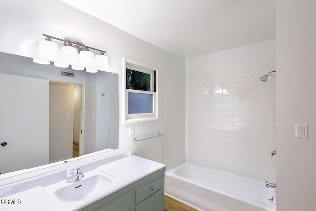 full bathroom with washtub / shower combination and vanity