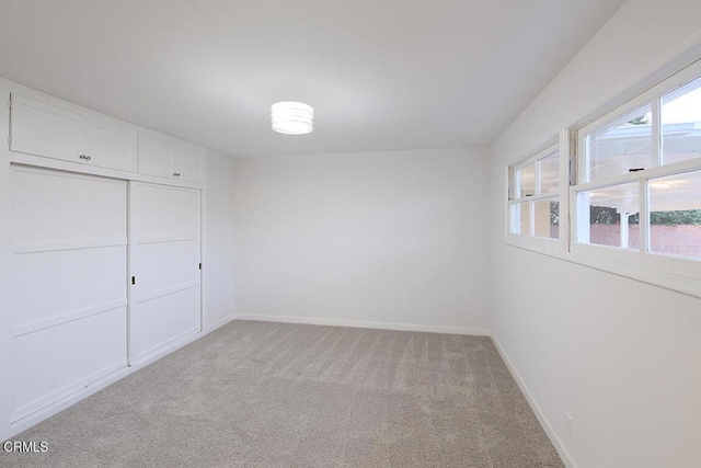 6429 Creemore Ln, Tujunga, CA 91042 - unfurnished bedroom featuring light colored carpet, baseboards, and a closet