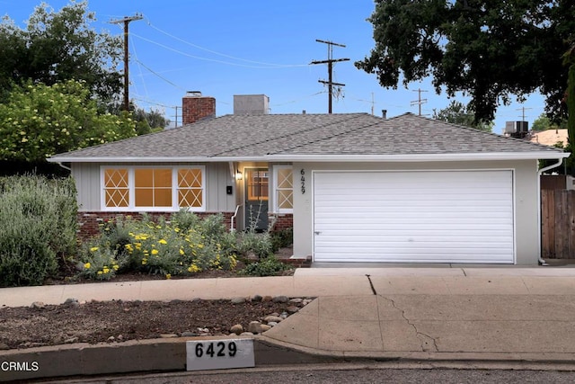 6429 Creemore Ln, Tujunga, CA 91042 - ranch-style house with a chimney, board and batten siding, a shingled roof, and brick siding