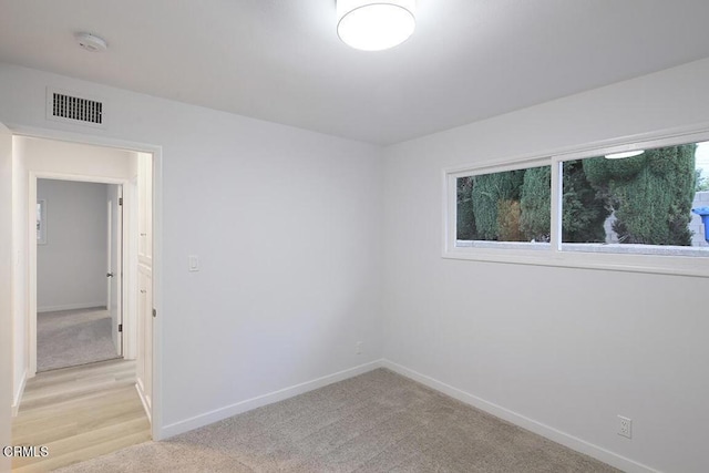 6429 Creemore Ln, Tujunga, CA 91042 - unfurnished room featuring baseboards, light carpet, and a smoke detector