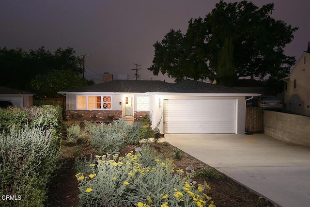 6429 Creemore Ln, Tujunga, CA 91042 - ranch-style home with concrete driveway and a garage
