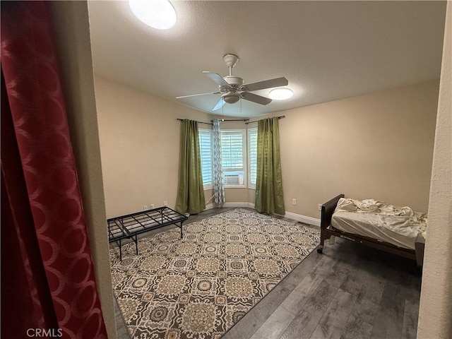 26825 Lazy Creek Rd, Menifee, CA 92586 - bedroom featuring wood finished floors, baseboards, cooling unit, and ceiling fan