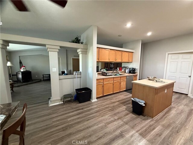 26825 Lazy Creek Rd, Menifee, CA 92586 - kitchen with stainless steel dishwasher, light countertops, dark wood-style flooring, a kitchen island, and recessed lighting