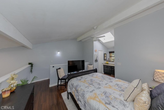 bedroom with wood finished floors, a skylight, and baseboards