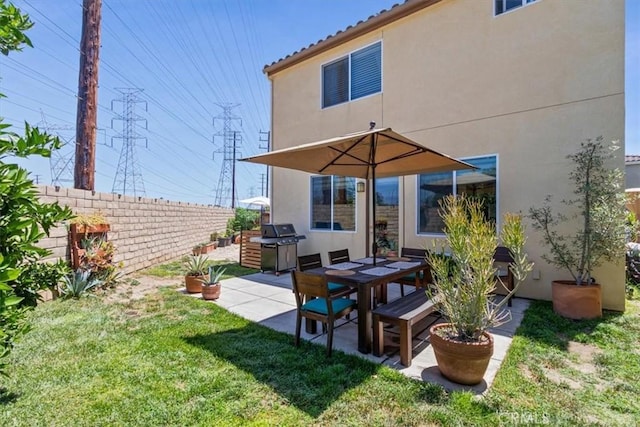 back of property featuring stucco siding and a patio area