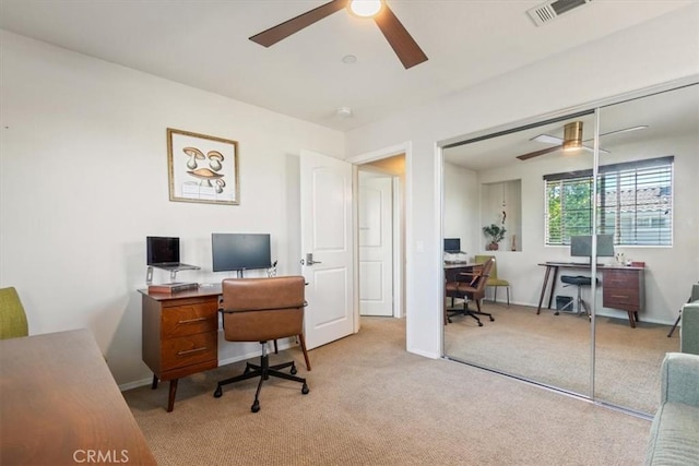 home office featuring a ceiling fan, carpet, and baseboards