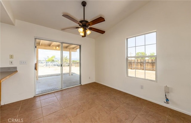 7728 Balsa Ave, Yucca Valley, CA 92284 - unfurnished room with ceiling fan, lofted ceiling, light tile patterned floors, and baseboards
