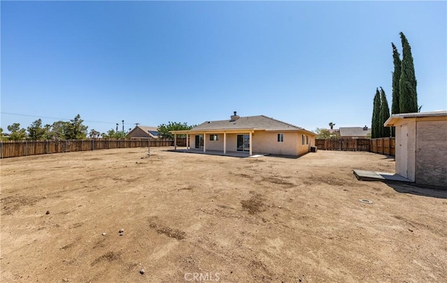 7728 Balsa Ave, Yucca Valley, CA 92284 - back of property with a fenced backyard and a patio