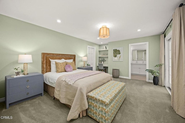 bedroom with carpet flooring, recessed lighting, baseboards, and connected bathroom