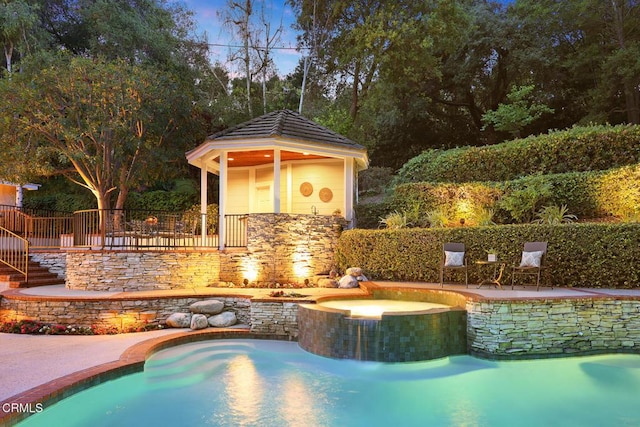 view of pool featuring a pool with connected hot tub
