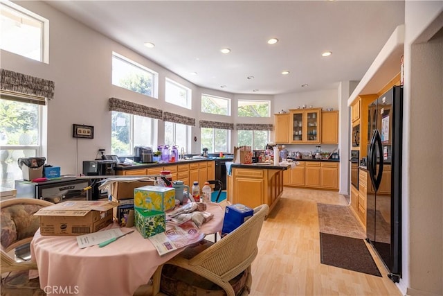 33220 Wilson St, Wildomar, CA 92595 - kitchen with black appliances, dark countertops, light wood finished floors, recessed lighting, and glass insert cabinets