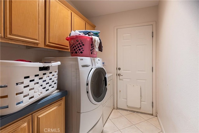 33220 Wilson St, Wildomar, CA 92595 - laundry room with washer and clothes dryer, light tile patterned floors, and cabinet space