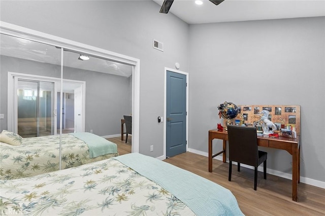 3660 Vista Campana N Unit 11, Oceanside, CA 92057 - bedroom with wood finished floors, baseboards, a towering ceiling, ceiling fan, and a desk