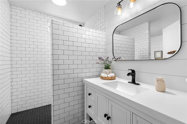 555 E Branch St, Arroyo Grande, CA 93420 - full bathroom featuring tile walls, a walk in shower, and vanity
