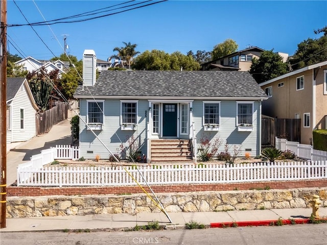 555 E Branch St, Arroyo Grande, CA 93420 - view of front of home featuring entry steps, a fenced front yard, and a chimney