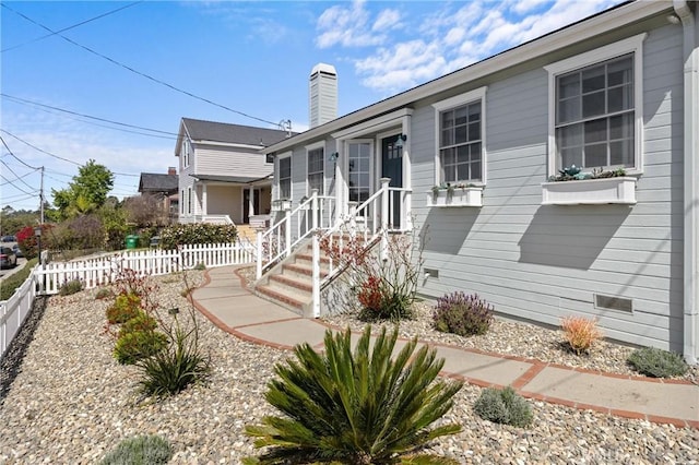 555 E Branch St, Arroyo Grande, CA 93420 - view of front of home featuring fence and a chimney