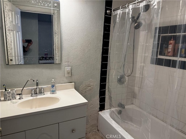 12145 Wanda St, El Monte, CA 91732 - full bathroom featuring a textured wall, vanity, and shower / tub combo with curtain