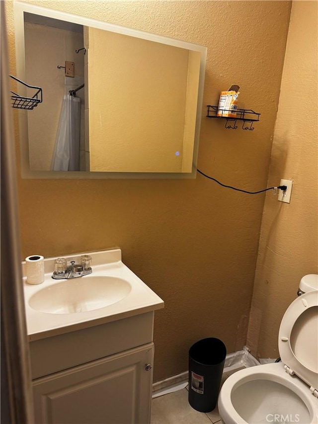 12145 Wanda St, El Monte, CA 91732 - full bathroom with toilet, vanity, curtained shower, a textured wall, and tile patterned flooring