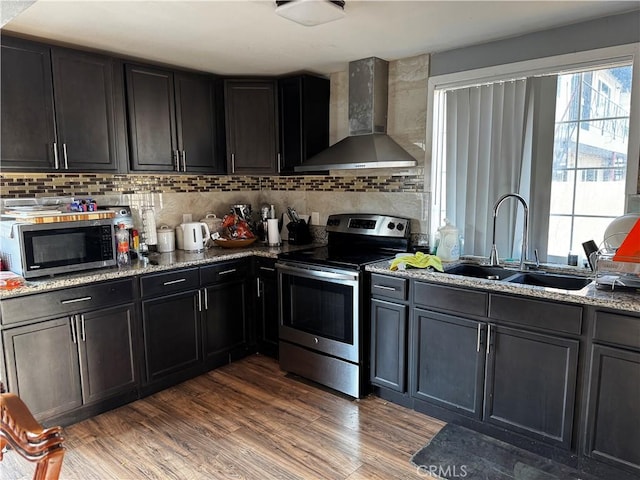 12145 Wanda St, El Monte, CA 91732 - kitchen featuring wall chimney exhaust hood, appliances with stainless steel finishes, a sink, and healthy amount of natural light