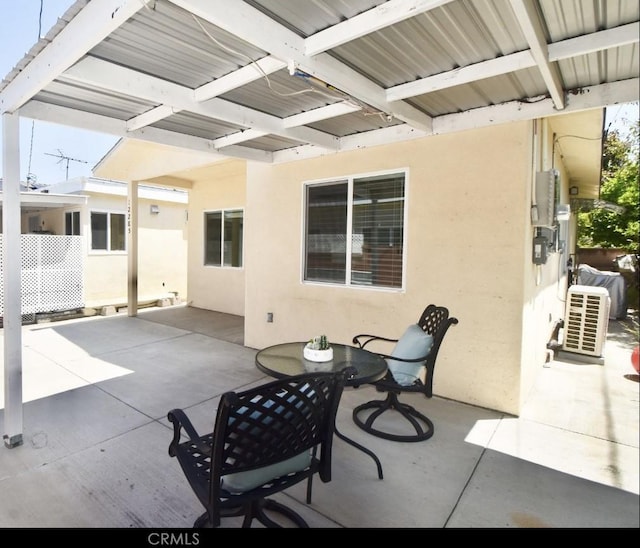 view of patio featuring outdoor dining area