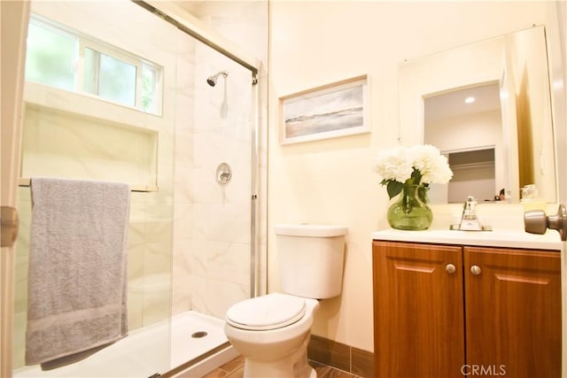 full bath with toilet, a shower stall, and vanity