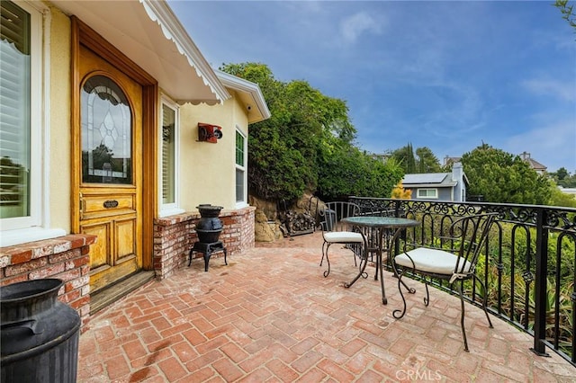 view of patio / terrace with a balcony