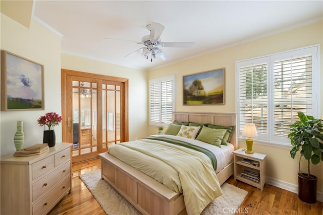 bedroom with crown molding, light wood-type flooring, access to exterior, baseboards, and ceiling fan