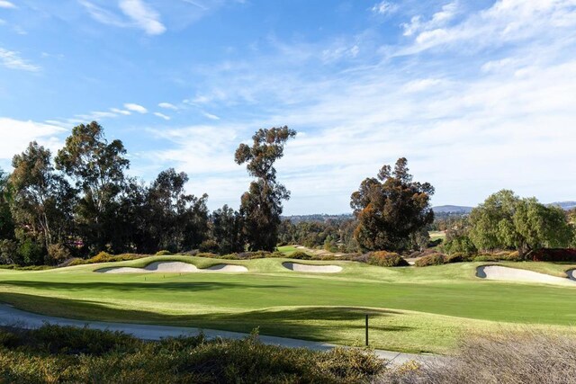 8374 St Andrews Rd, Rancho Santa Fe, CA 92067 - surrounding community featuring a lawn, view of golf course, and view of wooded area