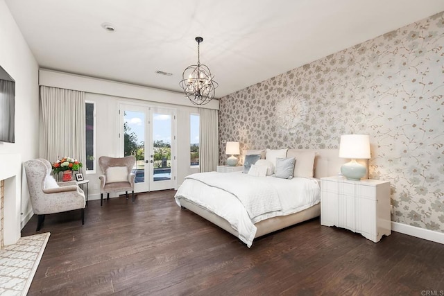 8374 St Andrews Rd, Rancho Santa Fe, CA 92067 - bedroom with wallpapered walls, access to exterior, dark wood finished floors, baseboards, and a chandelier