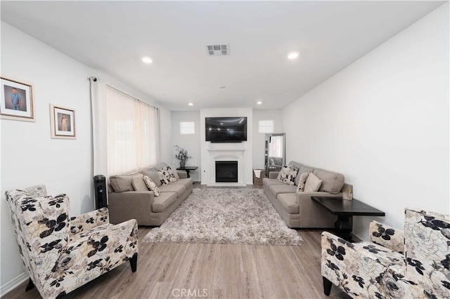 3225 E Denali Dr, Ontario, CA 91762 - living room featuring wood finished floors, a fireplace, and recessed lighting