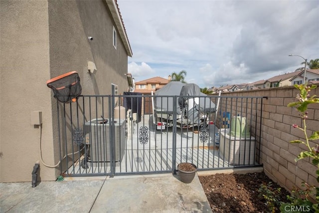 gate with fence and central AC