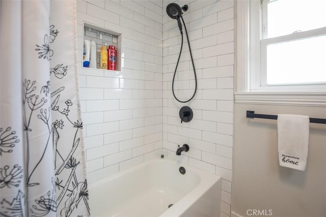 full bath featuring shower / tub combo with curtain