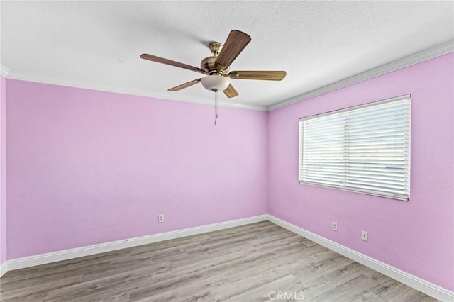 16129 Windcrest Dr, Fontana, CA 92337 - spare room with crown molding, baseboards, ceiling fan, and light wood-type flooring