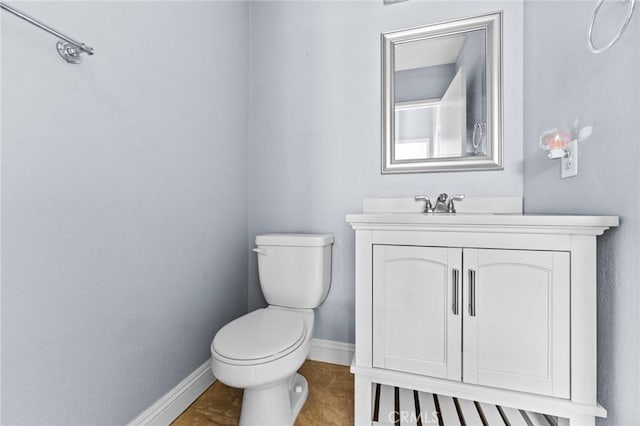 16129 Windcrest Dr, Fontana, CA 92337 - half bath featuring baseboards, toilet, and vanity