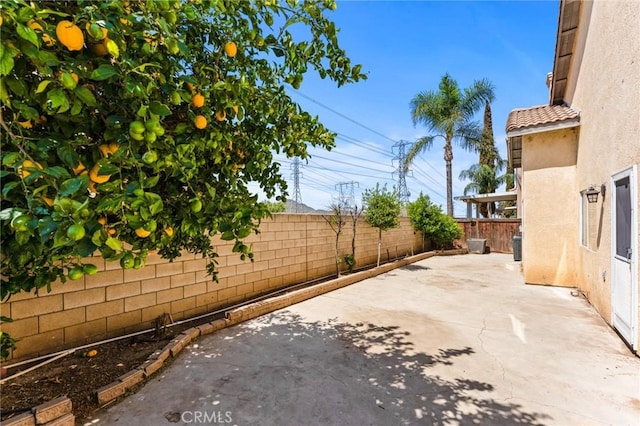 16129 Windcrest Dr, Fontana, CA 92337 - view of patio / terrace with a fenced backyard