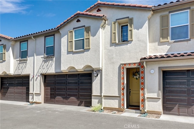 7354 Freesia Ln, Chino, CA 91708 - view of front of property featuring stucco siding, an attached garage, and a tiled roof