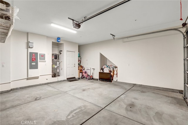 7354 Freesia Ln, Chino, CA 91708 - garage featuring a garage door opener and electric panel