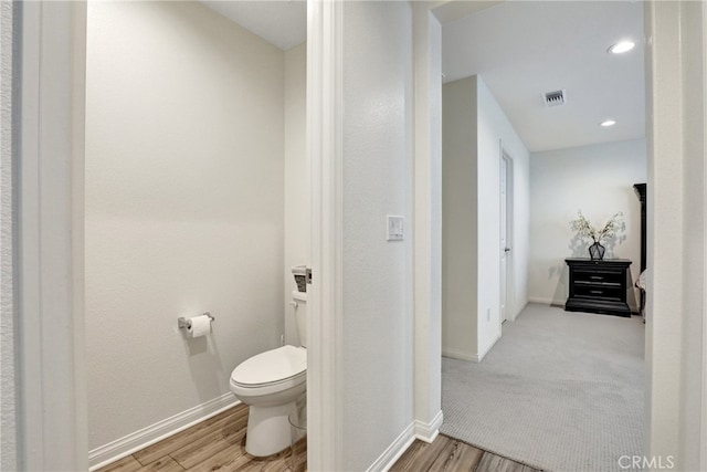7354 Freesia Ln, Chino, CA 91708 - bathroom featuring toilet, baseboards, wood finished floors, and recessed lighting
