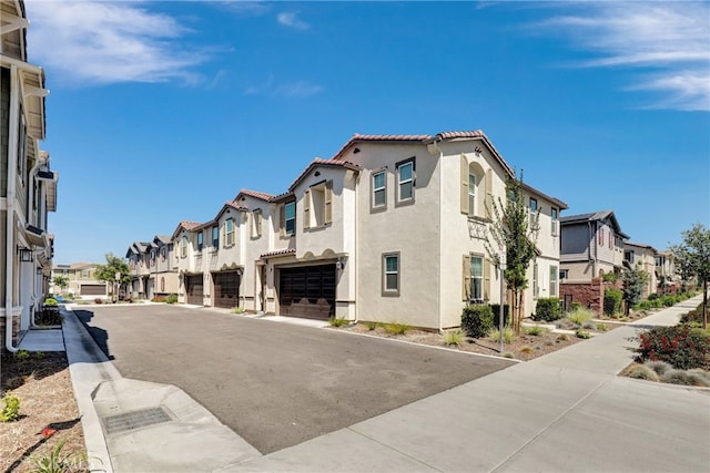 7354 Freesia Ln, Chino, CA 91708 - view of asphalt road featuring a residential view and sidewalks