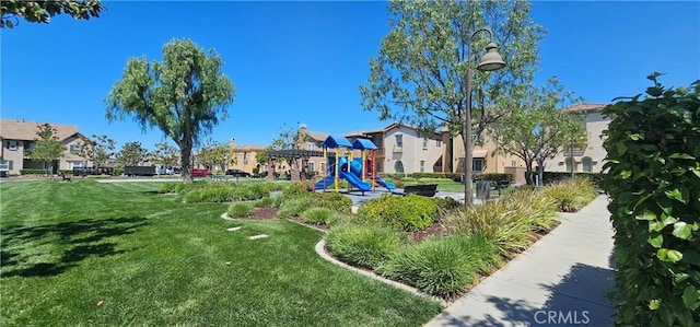 7354 Freesia Ln, Chino, CA 91708 - communal playground featuring a yard and a residential view