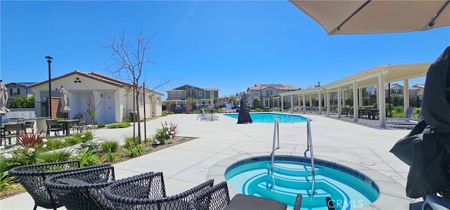 7354 Freesia Ln, Chino, CA 91708 - community pool featuring a hot tub, a patio area, and a residential view