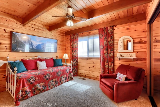 5027 Fox Creek Rd, Mariposa, CA 95338 - carpeted bedroom with wooden ceiling, beam ceiling, wooden walls, and ceiling fan