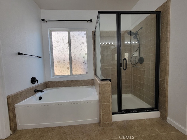 511 Milano Ct, Los Banos, CA 93635 - bathroom with a garden tub, a shower stall, and tile patterned flooring