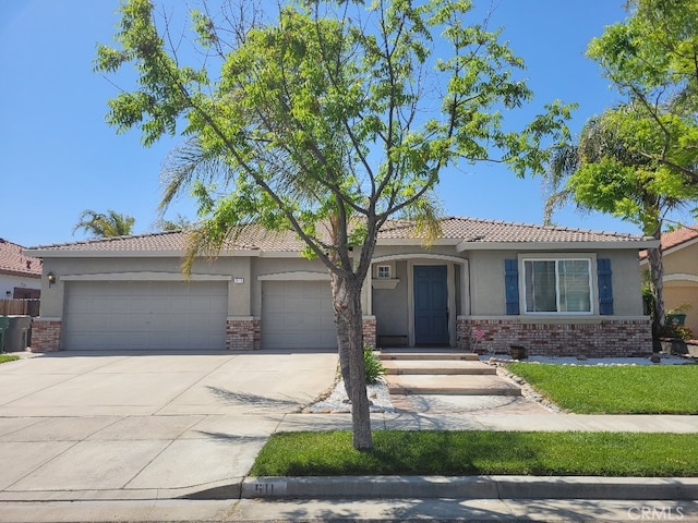 511 Milano Ct, Los Banos, CA 93635 - single story home featuring stucco siding, driveway, a garage, and brick siding