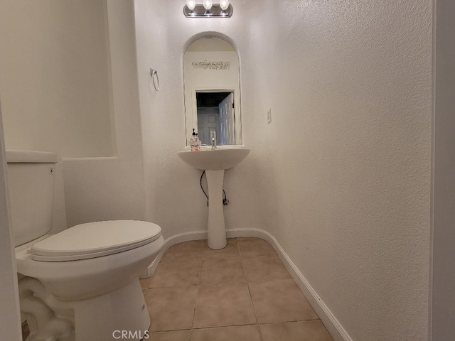 511 Milano Ct, Los Banos, CA 93635 - half bathroom featuring toilet and tile patterned flooring