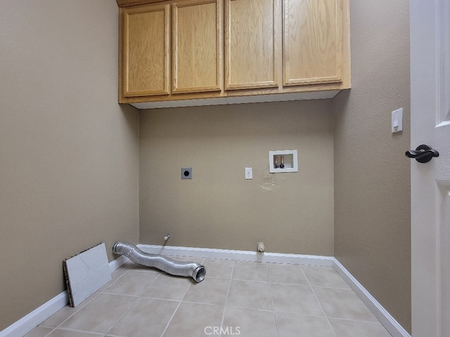 511 Milano Ct, Los Banos, CA 93635 - laundry area with electric dryer hookup, cabinet space, hookup for a washing machine, gas dryer hookup, and tile patterned flooring