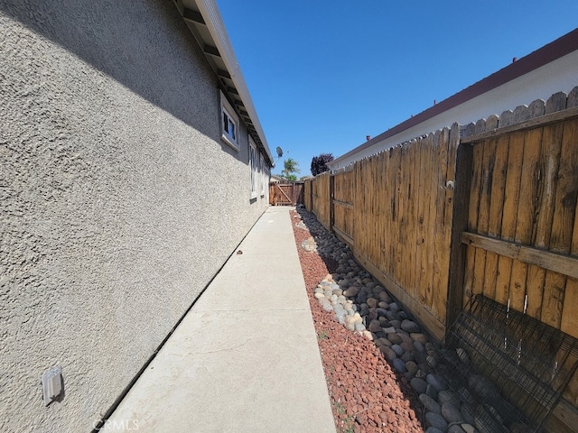 511 Milano Ct, Los Banos, CA 93635 - view of property exterior featuring fence and stucco siding