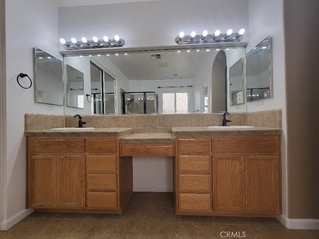 511 Milano Ct, Los Banos, CA 93635 - bathroom with double vanity, a shower stall, and tile patterned floors