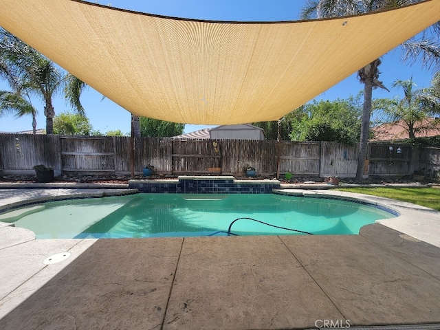 511 Milano Ct, Los Banos, CA 93635 - view of swimming pool featuring a patio and a fenced backyard